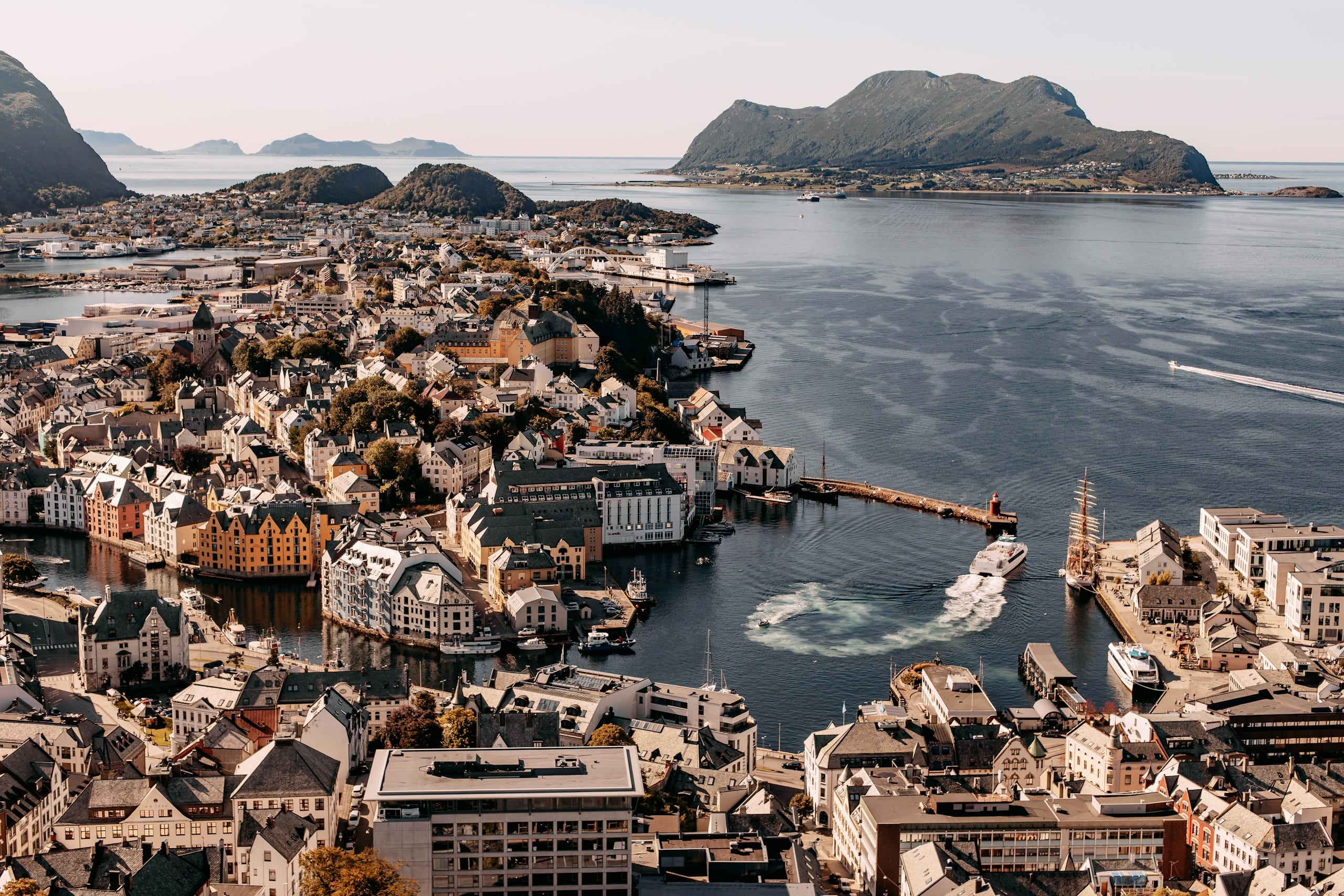 Ålesund's harbour with boats moored along the waterfront and Art Nouveau buildings rising behind the docks